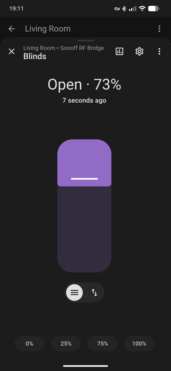 Screenshot of the Home Assistant app on a phone, showing the living room blinds open at 73%